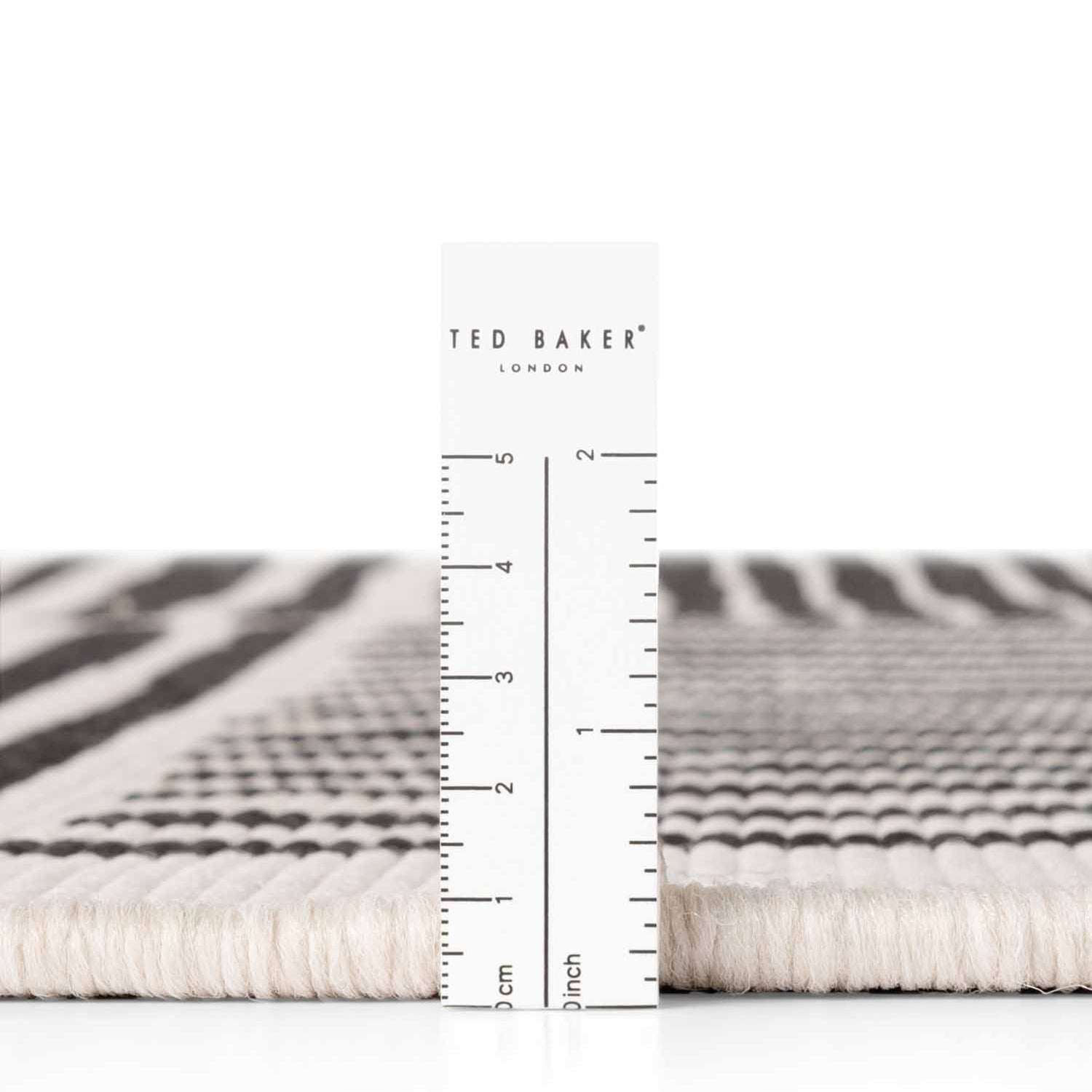 Tapis extérieur rond lavable Bound Crème et Noir - Ted Baker