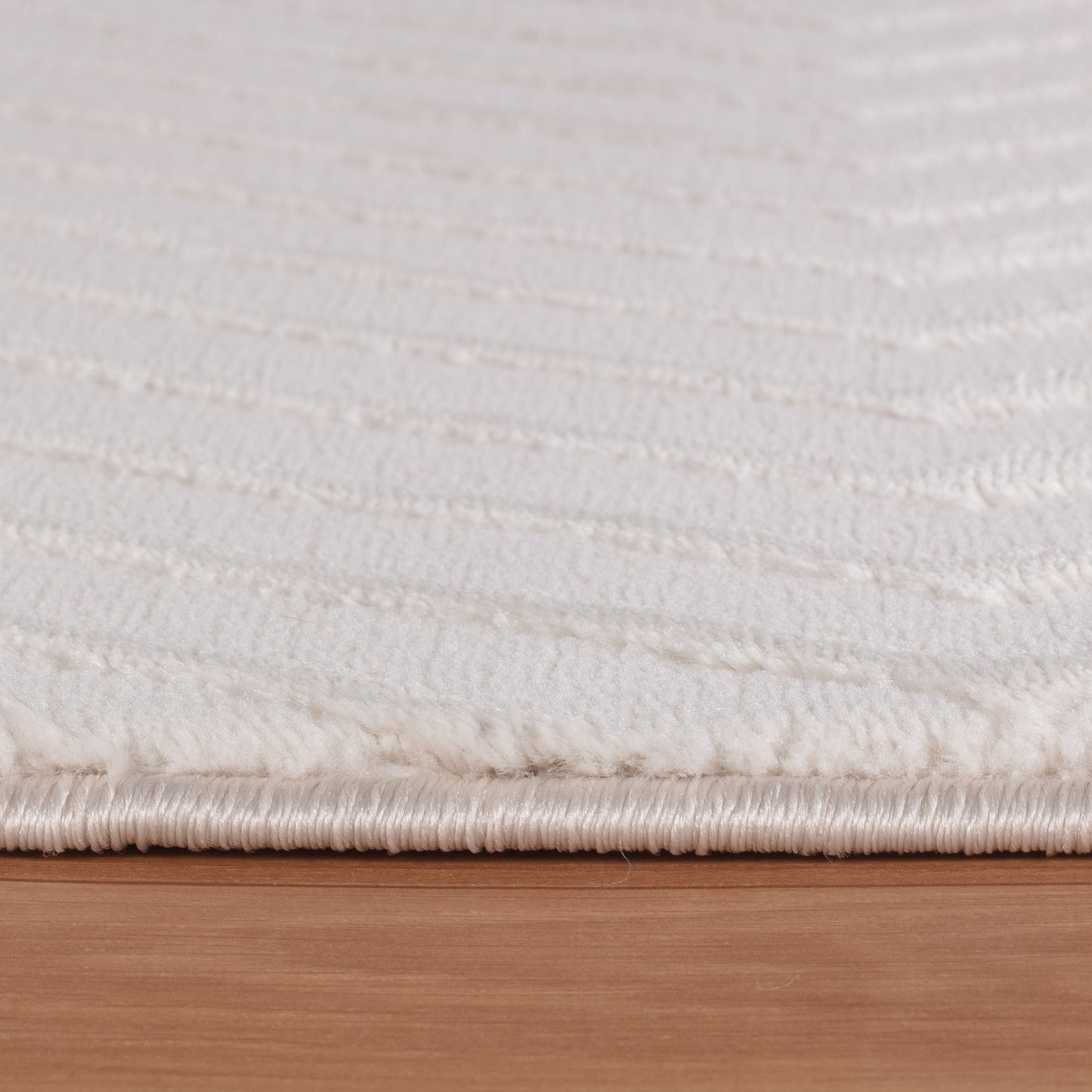 Tapis Noa laineux à motif en relief - Crème