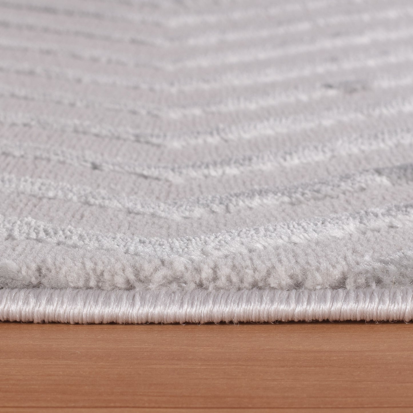 Tapis Noa laineux à motif en relief - Gris