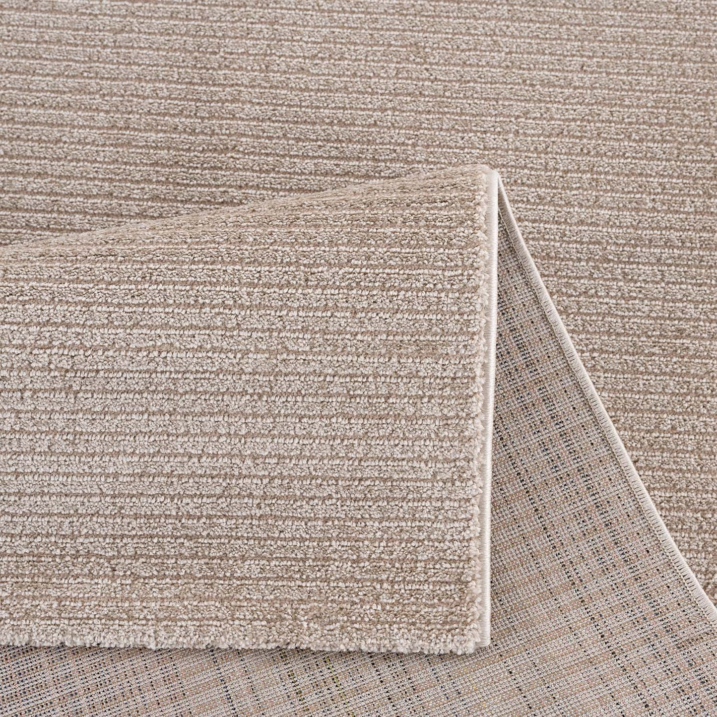 Tapis uni à motifs lignes en relief - Beige