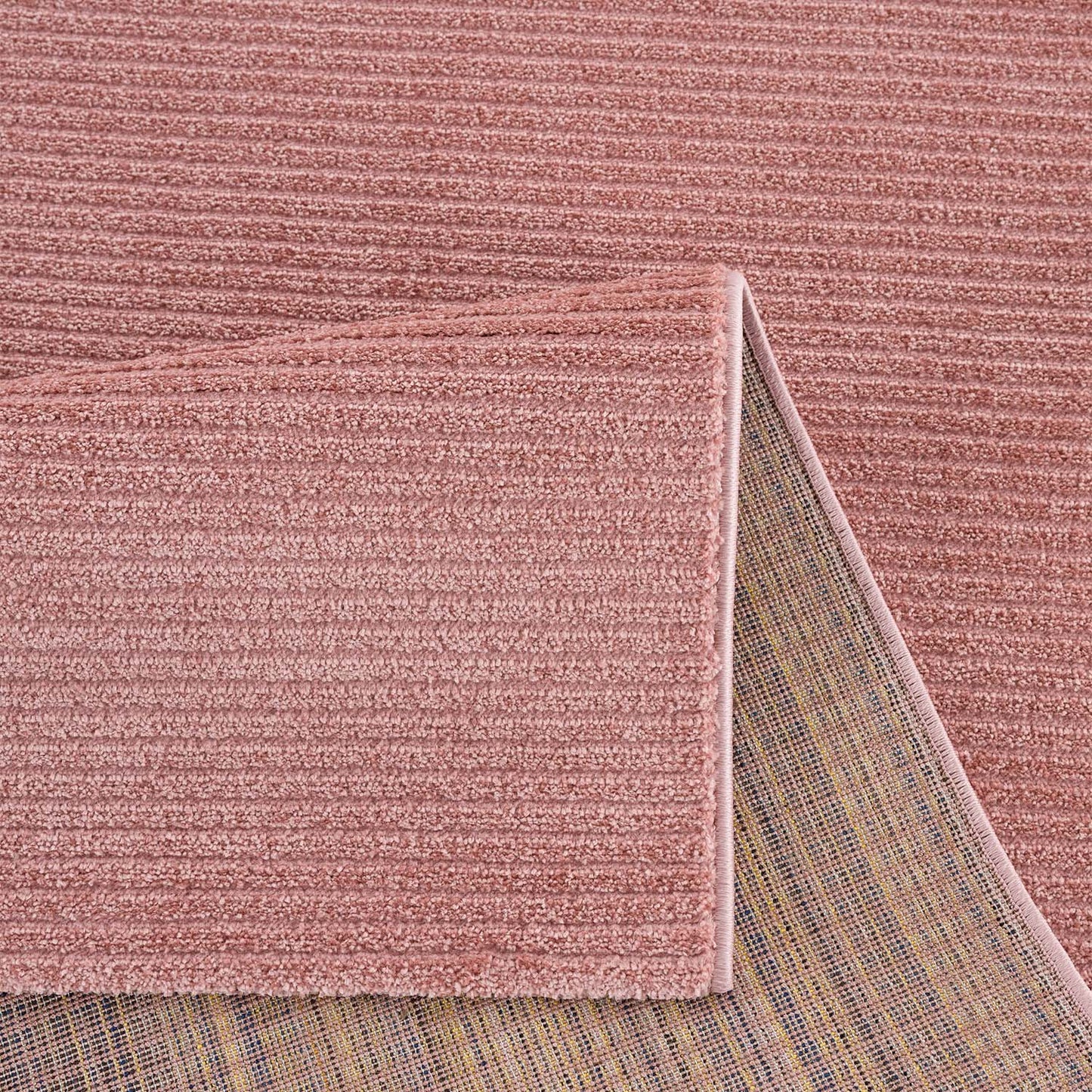 Tapis uni à motifs lignes en relief - Rose