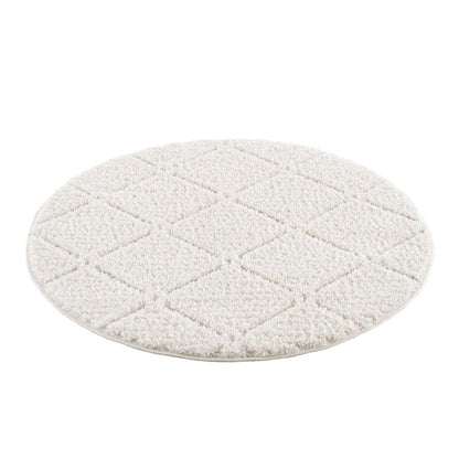 tapis rond crème à poils longs et motifs relief