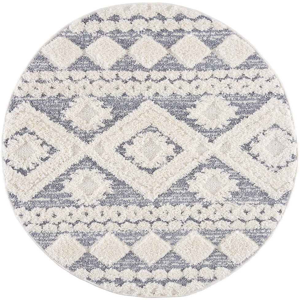 tapis rond gris à poils longs et motifs relief