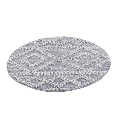 tapis rond gris à poils longs et motifs relief