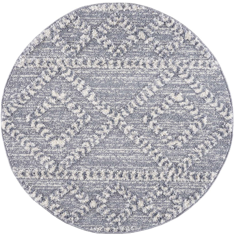 tapis rond gris à poils longs et motifs relief