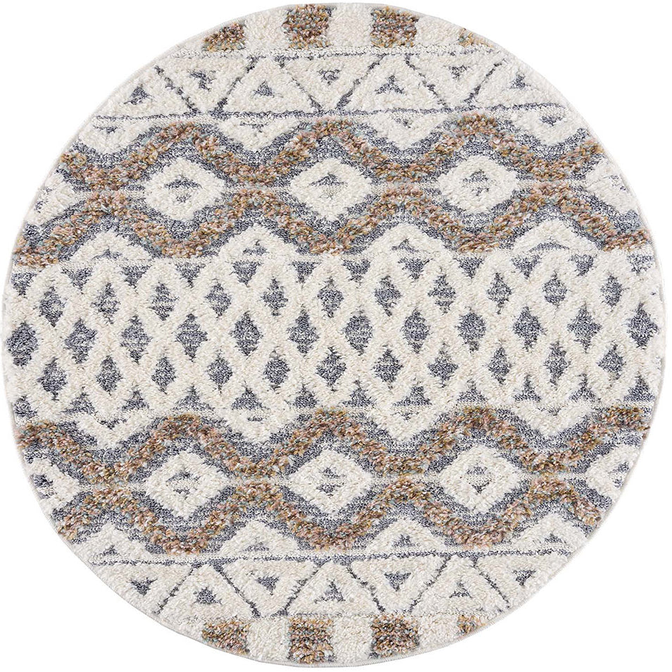 tapis rond gris à poils longs et motifs relief