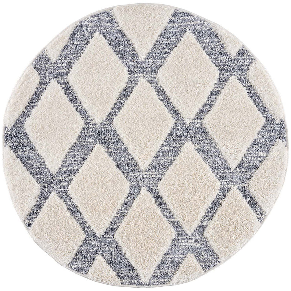 tapis rond gris à poils longs et motifs relief